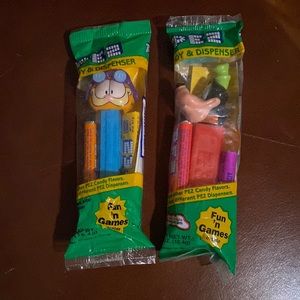 2 Pezz unopened candy dispensers, Garfield, and Pluto